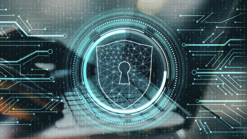 futuristic lock in front of a computer being used.