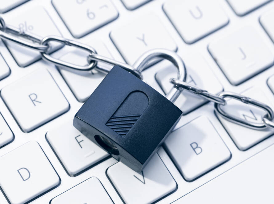 Picture of a keyboard with a lock over the top of it.